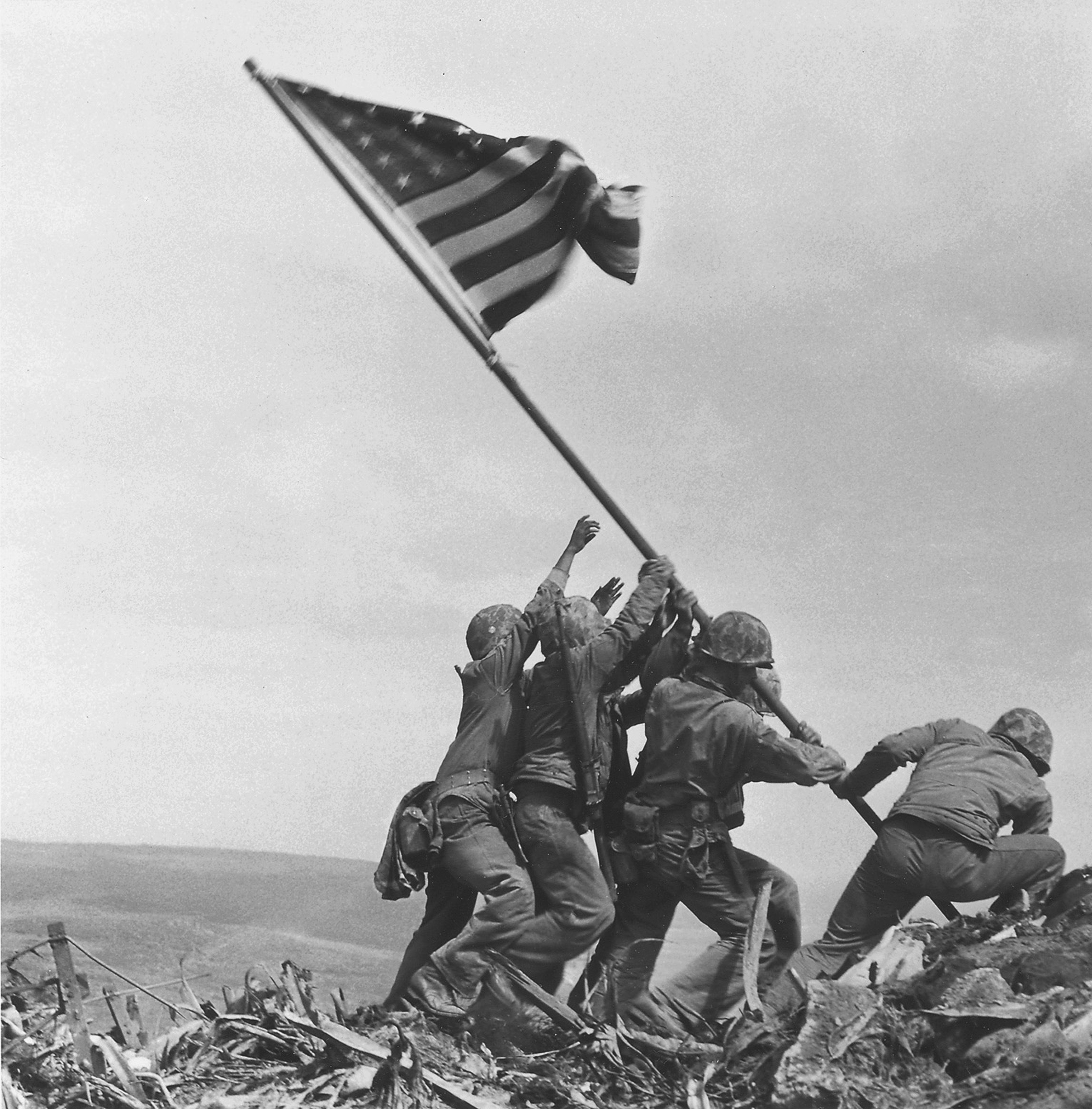 U.S. service members raise the American flag atop Mt. Suribachi in Iwo Jima, Japan, on Feb. 23, 1945. The Marine Corps is investigating whether some of the men in the photo have been misidentified.
